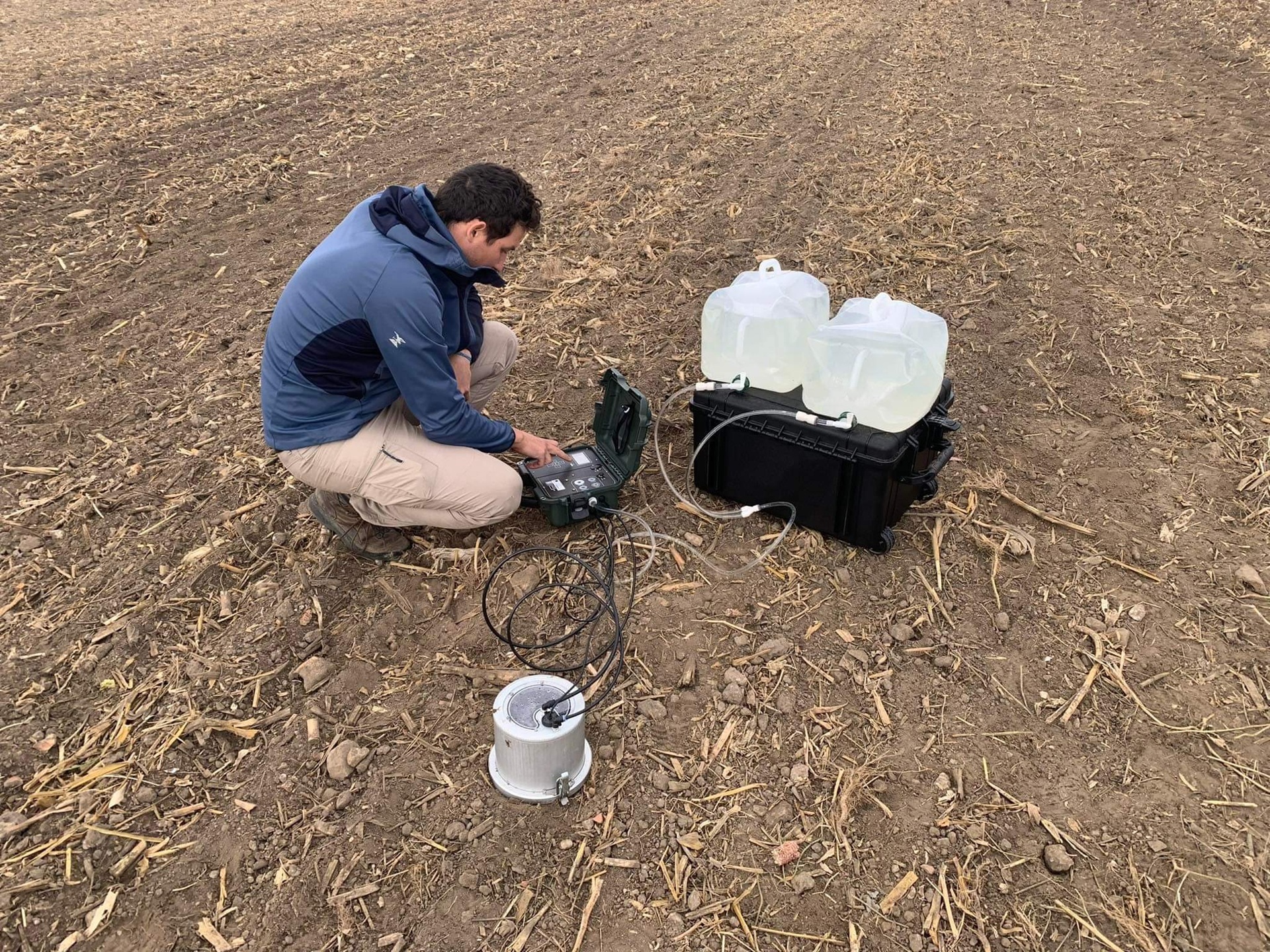 Field technician setting up monitoring equipment